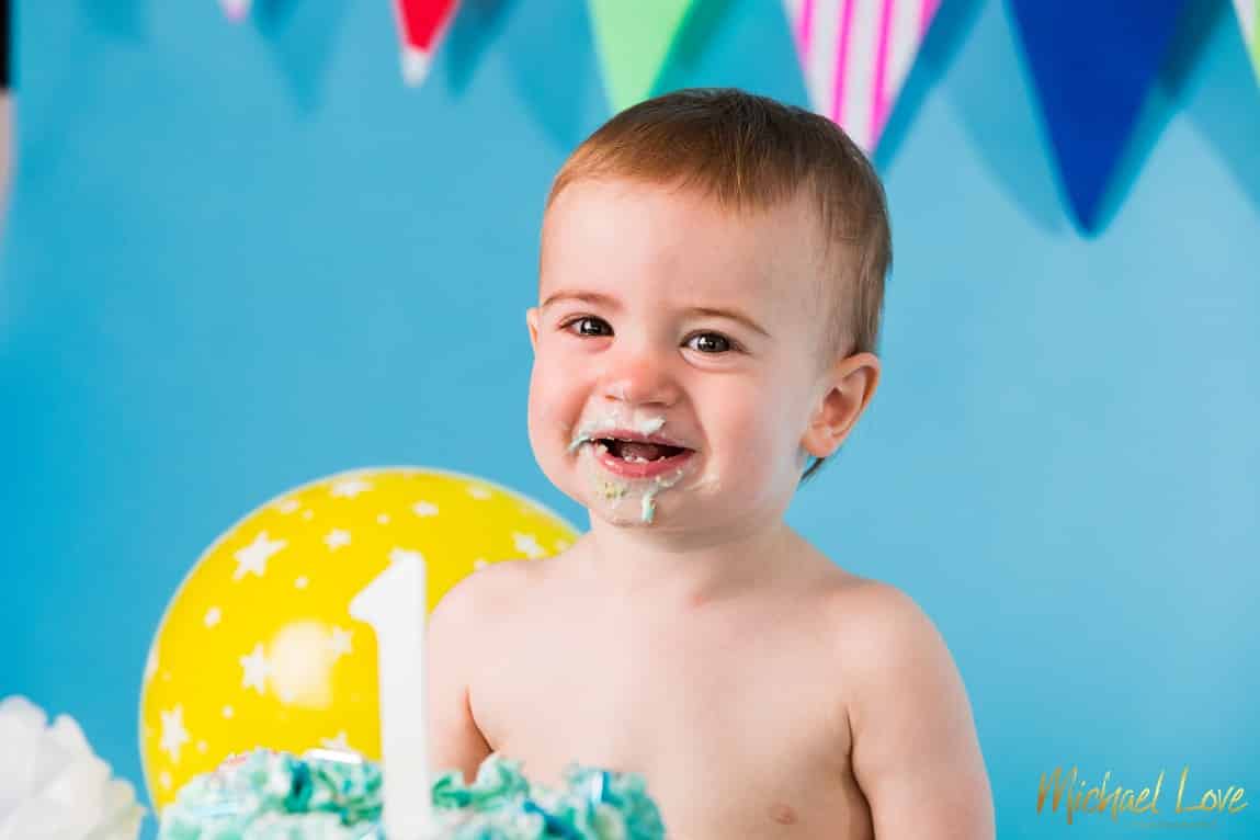 Boy enjoying his cake smash photos