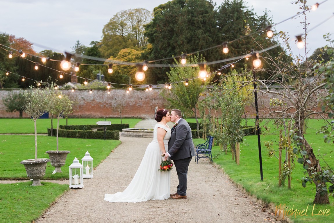 Wedding couple kissing in Drenagh gardens